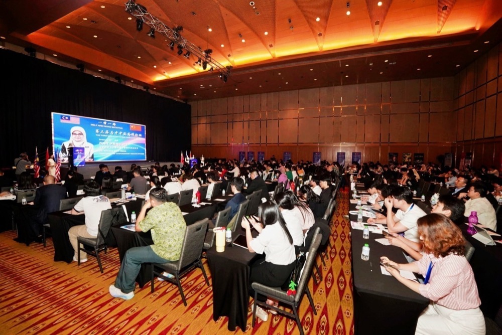 Wide view of the conference hall filled with delegates